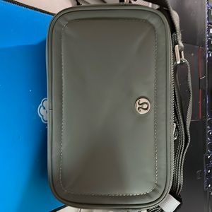 🍋LULULEMON | Crossbody Camera Bag in Grey, two zip pockets, strap drop is 26”.